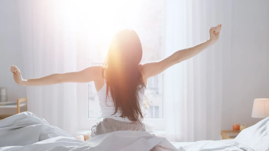 Woman waking up and feeling refreshed